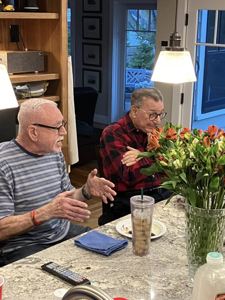 LGBTQ+ Newton members gathered around table for Thanksgiving