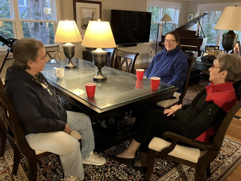 LGBTQ+ Newton members gathered around table for Thanksgiving
