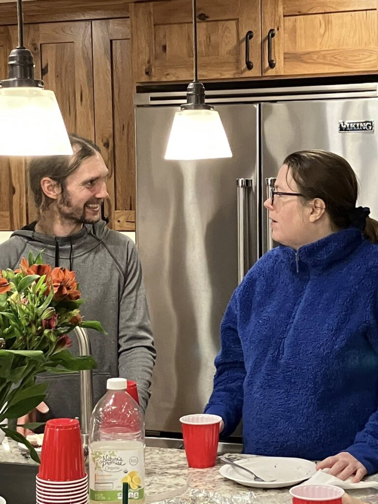 LGBTQ+ Newton members gathered in kitchen for Thanksgiving