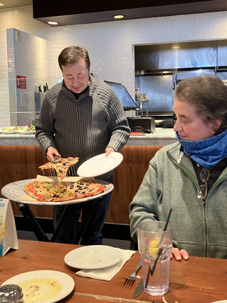 LGBTQ+ Newton members enjoying pizza at Bertucci's